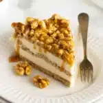Butter Brickle Frozen Delight 3 A square slice of Butter Brickle Frozen Delight with creamy layers, toffee bits, and a golden graham cracker crust, served on a dessert plate.